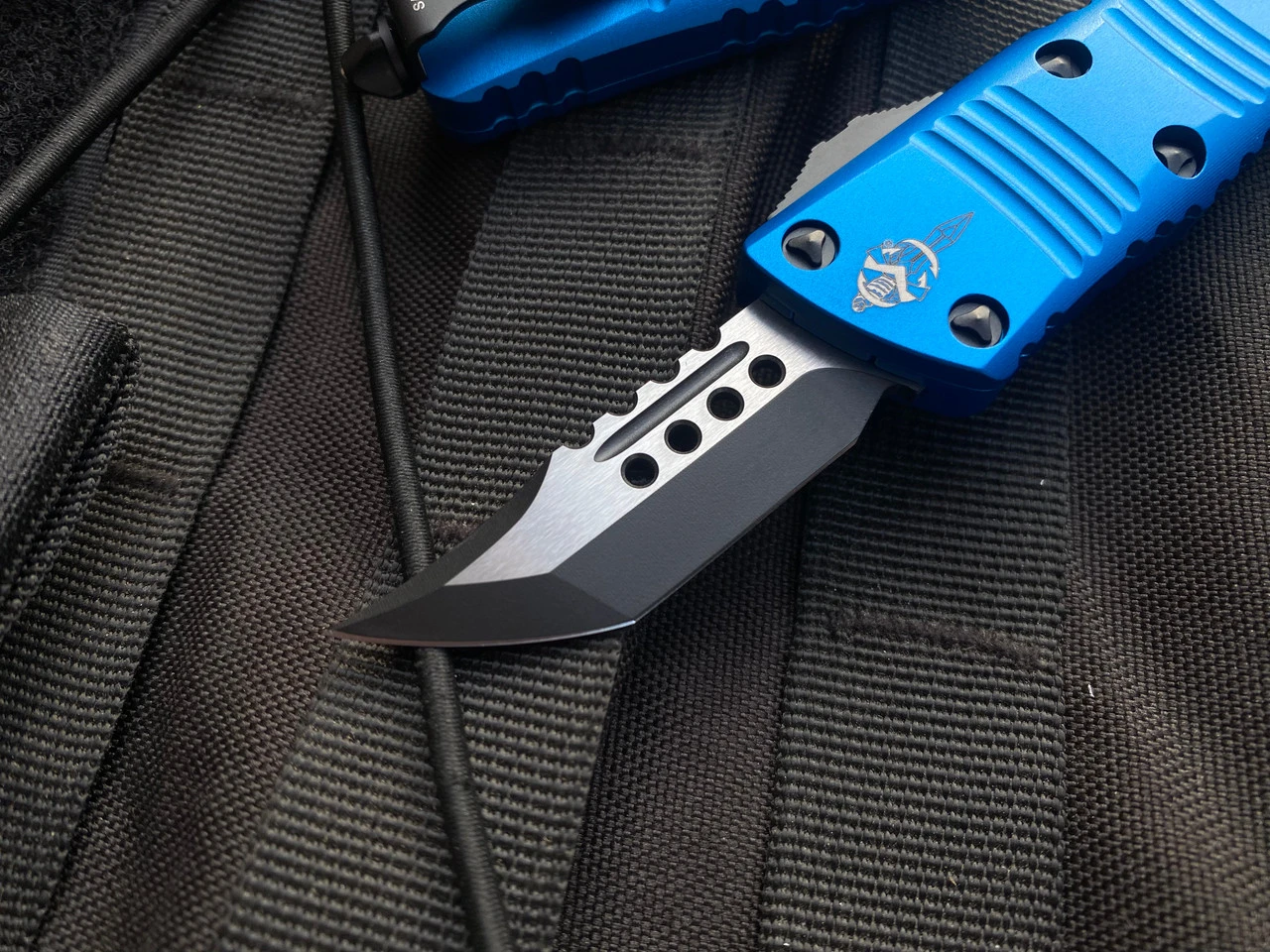 Microtech Mini Troodon Hellhound Blue Aluminum Body W/ Two Tone Black Plain Edge Blade (1.99") 819-1BLS 4 Microtech Mini Troodon Hellhound Blue Aluminum Body W/ Two Tone Black Plain Edge Blade (1.99") 819-1BLS - Image 4
