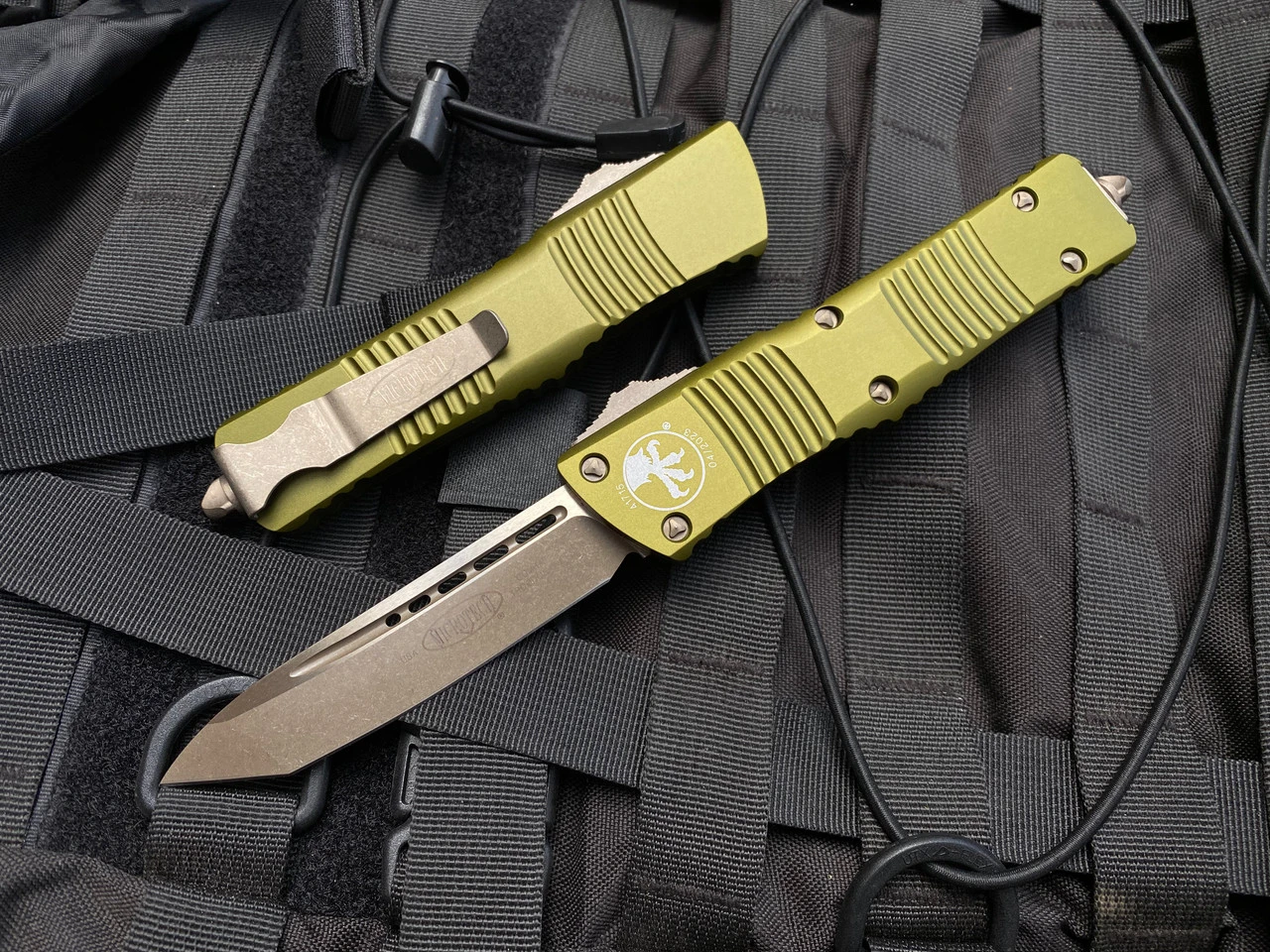 Microtech Combat Troodon T/E OD Green Aluminum Body W/ Bronzed Apocalyptic Hardware And Plain Edge Blade (3.8") 144-13APOD 1 Microtech Combat Troodon T/E OD Green Aluminum Body W/ Bronzed Apocalyptic Hardware And Plain Edge Blade (3.8") 144-13APOD