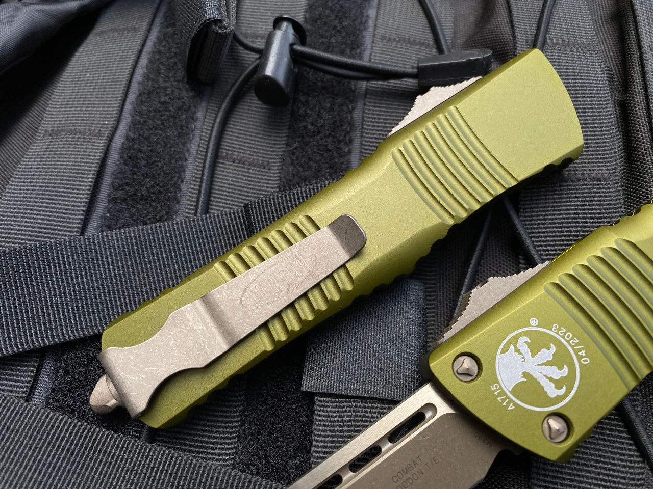 Microtech Combat Troodon T/E OD Green Aluminum Body W/ Bronzed Apocalyptic Hardware And Plain Edge Blade (3.8") 144-13APOD 2 Microtech Combat Troodon T/E OD Green Aluminum Body W/ Bronzed Apocalyptic Hardware And Plain Edge Blade (3.8") 144-13APOD - Image 2