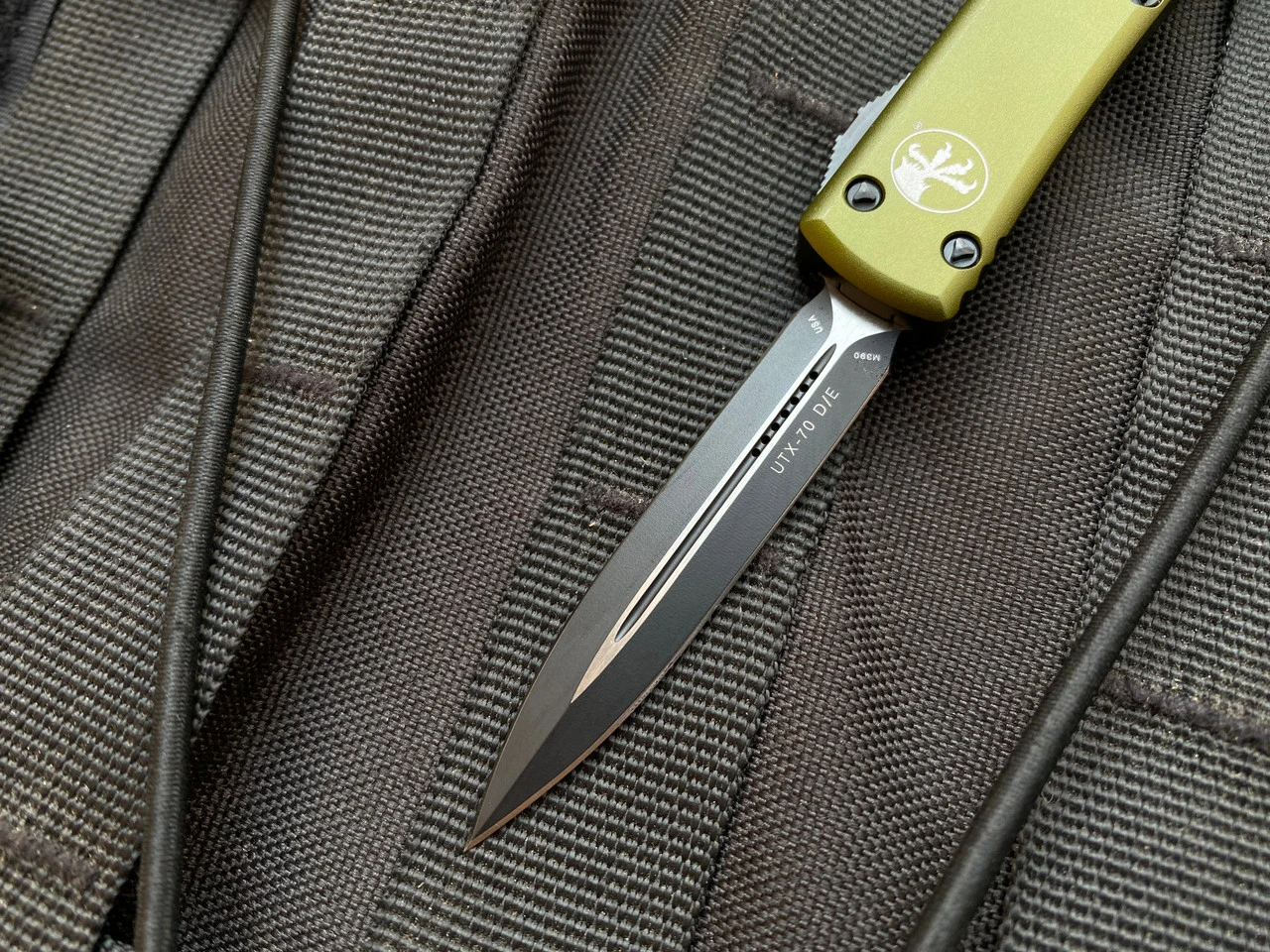 Microtech UTX-70 D/E OD Green Aluminum Body W/ Black Plain Edge Blade (2.42") 147-1OD 4 Microtech UTX-70 D/E OD Green Aluminum Body W/ Black Plain Edge Blade (2.42") 147-1OD - Image 4
