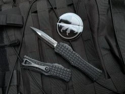 Microtech Hera Frag Pattern Black Aluminum Body W/ Black Tactical Partially Serrated Blade (3.08”) 702-2TFRS