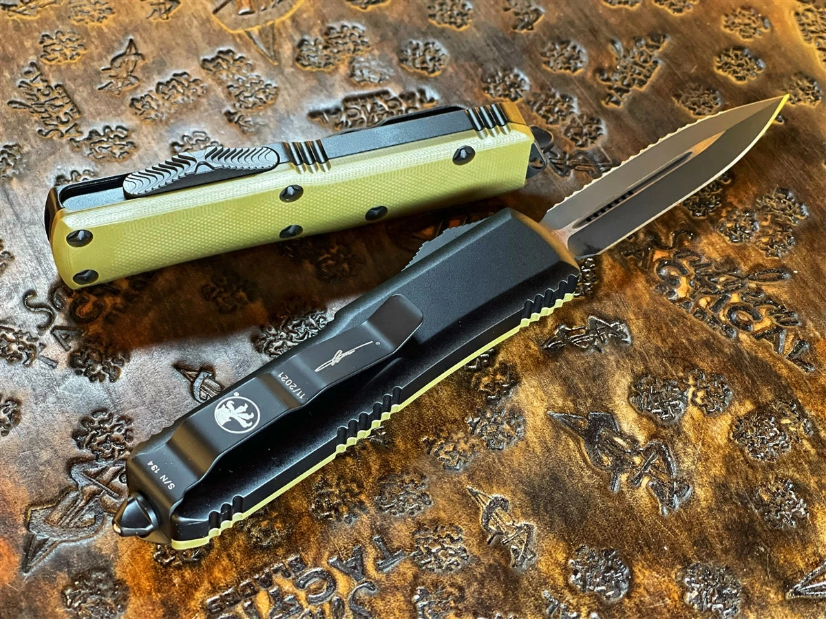 Microtech UTX-85 Double Edge Full Serrated G10 OD Green Top 2 Microtech UTX-85 Double Edge Full Serrated G10 OD Green Top - Image 2