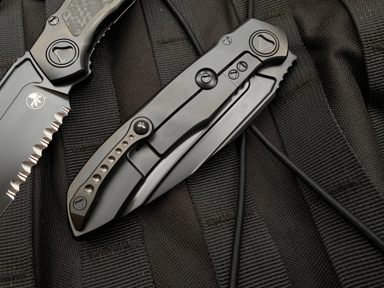 Microtech Anax S/E Integral Folder Full DLC Titanium Carbon Fiber Inlaid Body W/ DLC Partially Serrated Blade (3.69”) 190C-2DLCTCFITI 4 Microtech Anax S/E Integral Folder Full DLC Titanium Carbon Fiber Inlaid Body W/ DLC Partially Serrated Blade (3.69”) 190C-2DLCTCFITI - Image 4