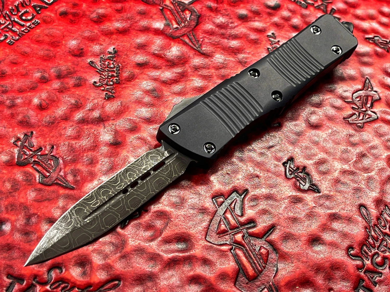 Microtech Troodon Double Edge Damascus Signature Series Ringed Titanium Hardware 1 Microtech Troodon Double Edge Damascus Signature Series Ringed Titanium Hardware